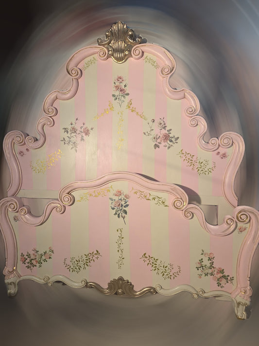 Decorative headboard with floral patterns and gold accents on a plain background. Upcycled Antique Pink Cottage Bedframe Headboard \| La Vie Nouveau Décor Shoppe