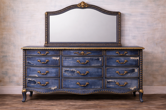 Vintage-style blue dresser with gold accents against a neutral wall. Upcycled Antique Torn Denim Wide Dresser \| La Vie Nouveau Décor Shoppe